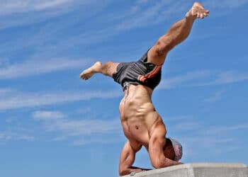 Inversion - Forearm Stand Side Split Pose – an advanced inversion combining a forearm balance with legs extended sideways into a full split.