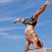 Inversion - Forearm Stand Side Split Pose – an advanced inversion combining a forearm balance with legs extended sideways into a full split.